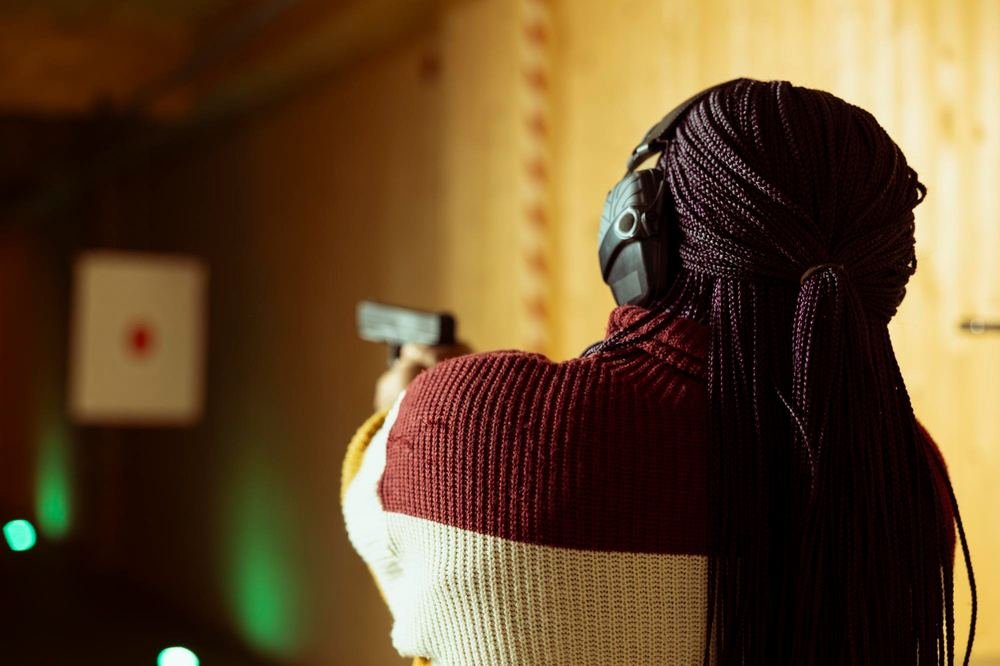 Shooter on the range, headphones on