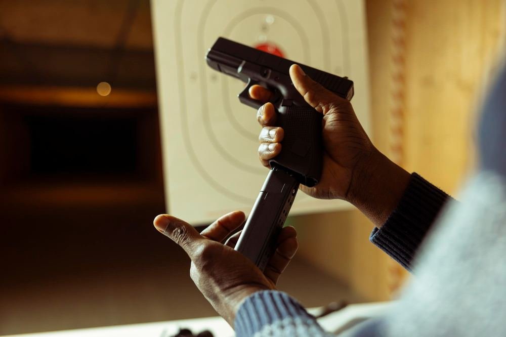 Shooter checking a pistol before firing