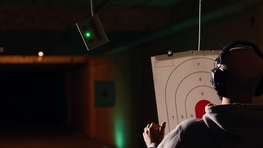 Shooter aiming with laser sight